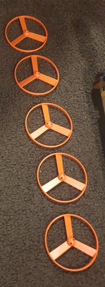 Set of 5 orange plastic wheels/rings